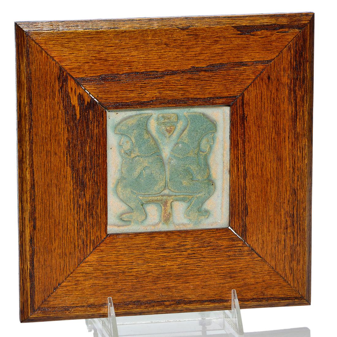 Pewabic Pottery tile, hooded gnomes, 3 3/4”, wood: Pewabic 3 3/4 inch square tile showing two hooded gnomes seated back to back covered by a matte aqua glaze. Unmarked. Factory chip to back corner. Excellent condition. Nice 8 1/2 inch square Arts & Cr