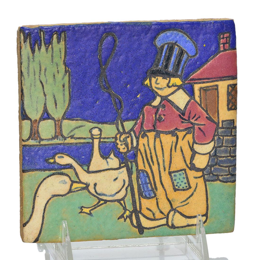 Empire Tile Co tile, Dutch boy w/geese, 5 3/4”: Empire Tile Company 5 3/4 inch square tile incised with a Dutch boy with geese glazed with bold colors. Impressed Empire and slip notations PA #32, Dec 28 on the back. Two back corners have small chip