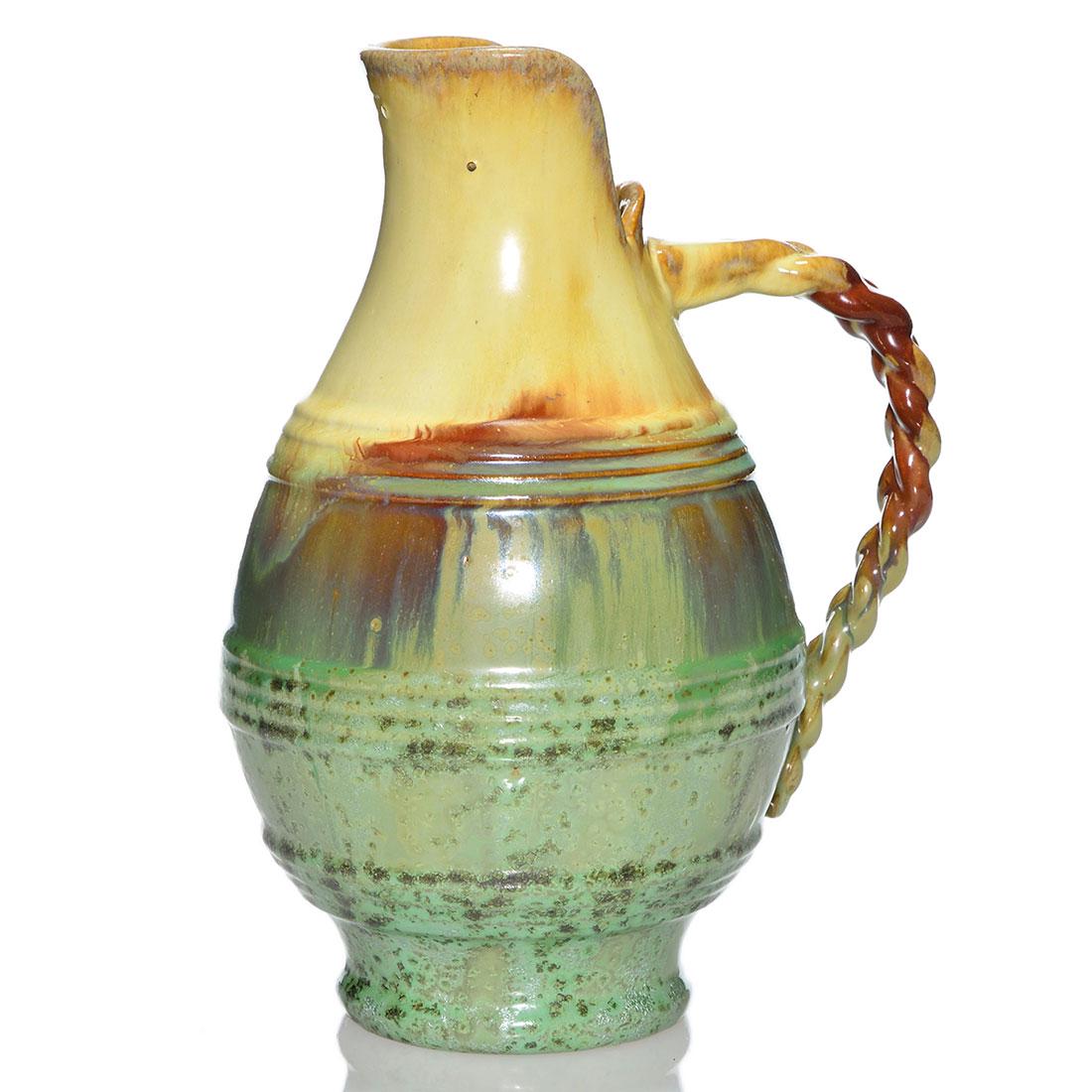 Fulper handled jug, ivory over green crystalline,10 3/8: Fulper handled jug, shape 540, covered in ivory over green crystalline glazes. Marked with the rectangular Fulper ink stamp. There are a few open bubbles in the glaze. Height is 10 3/8 inches.