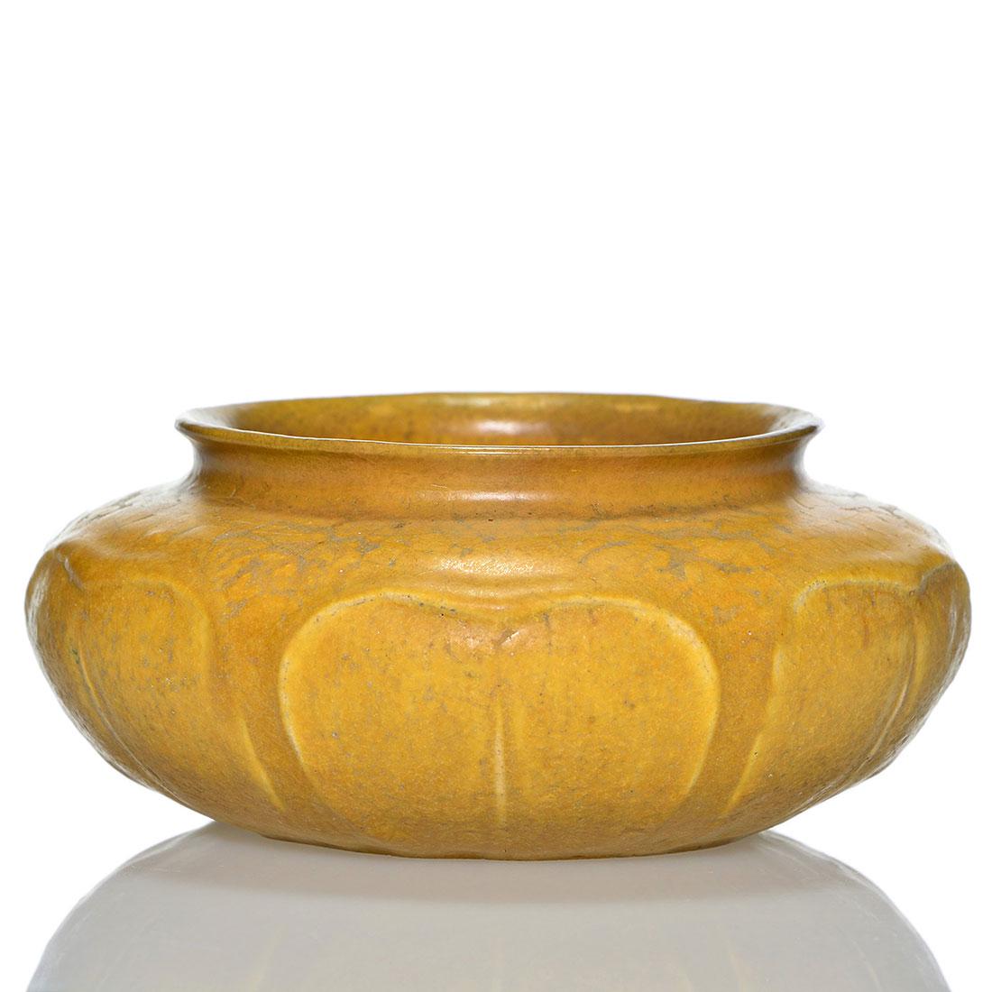 Grueby low bowl, leaf design,yellow mat, 2 1/4 x 5: Grueby low bowl with leaf design covered in yellow mat glaze. Impressed with the circular Grueby mark and incised with the initials S M. There has been professional repair to the rim. Size is 2 1/4 in