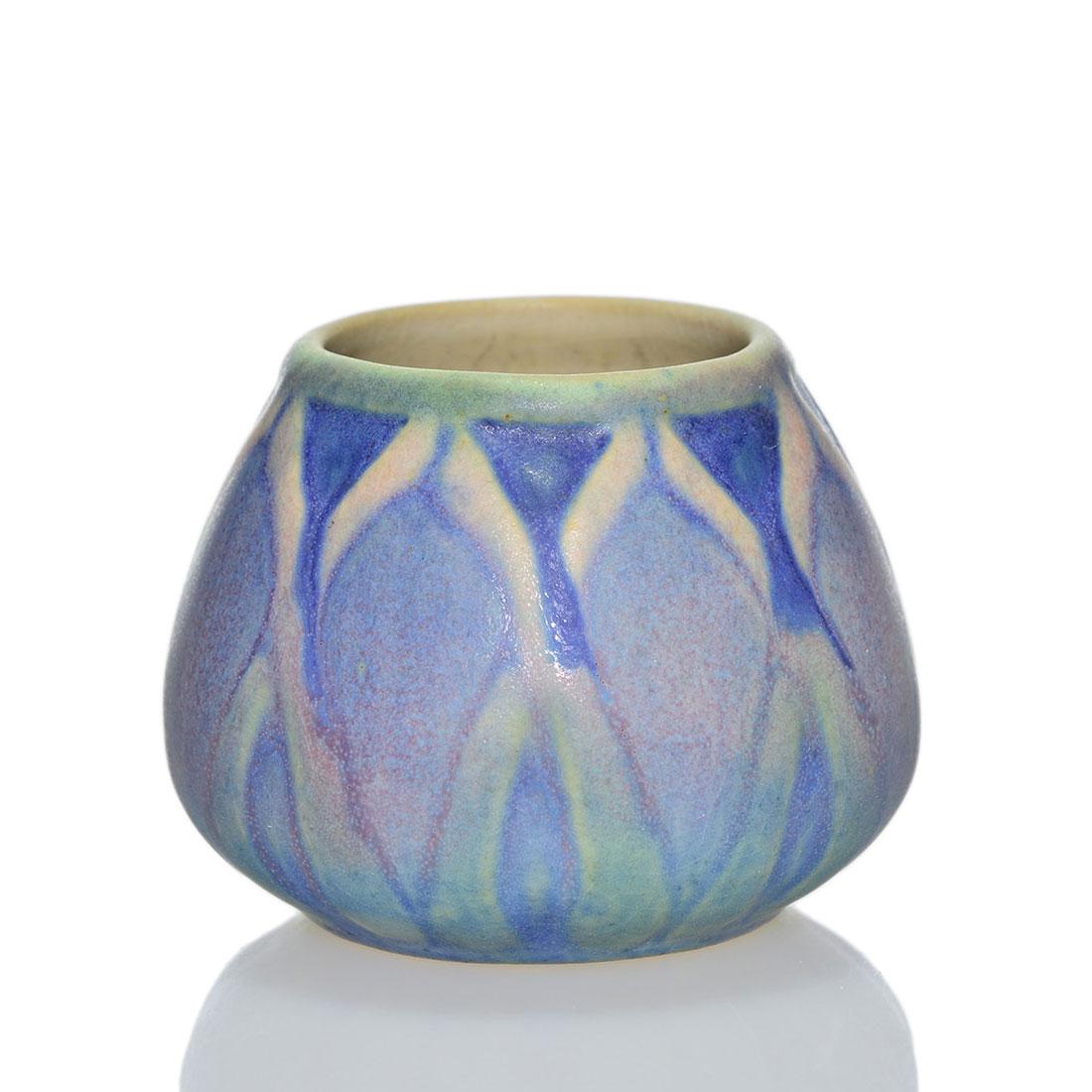 Newcomb College mini vase, spiky flower, Irvine, 2: Newcomb College cabinet vase with repeating spiky flowers done by Sadie Irvine in 1932. Impressed Newcomb College logo, date code for 1932 (UA 72) along with incised KS for potter Kenneth Smith and in
