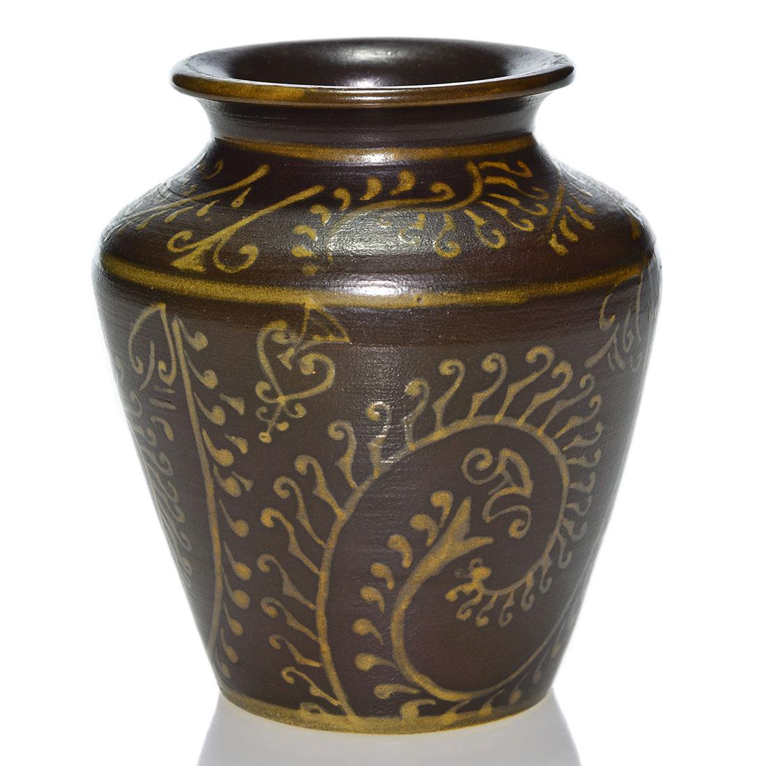 UND Bentonite vase, ferns, Thormodsgard, ca 35, 4 5/8: Unusual Bentonite vase with slip decorated ferns done, circa 1935, by Marie B. Thormodsgard. Decoration in gold is done over the dark brown ground. Marks include the circular UND ink stamp logo and th
