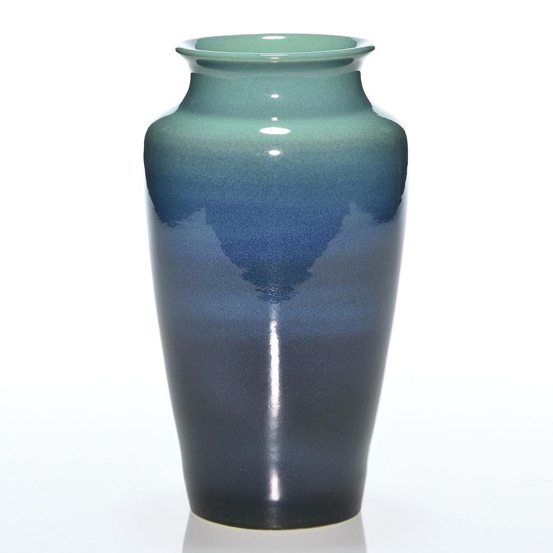 UND glossy vase, blues, L.M. Benson, ca 1950, 8 1/2: Nicely glazed vase in shades of blue done, circa 1950, by Luella M. Benson. Marked with the circular UND ink stamp logo and the incised initials of the artist. Height 8 1/2 inches. Uncrazed and very c
