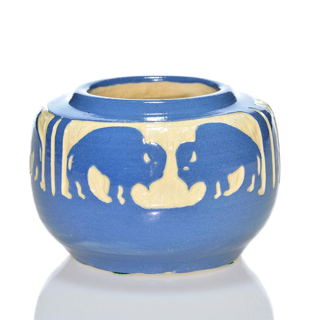 UND carved bison vase, Julia Mattson, 3 x 4 3/4: UND carved semi gloss glaze vase with two facing buffalos within three textured panels done by Julia Mattson. Measures 3 inches by 4 3/4 inches across. Incised JM 794 and has the UND ink stamp logo. P