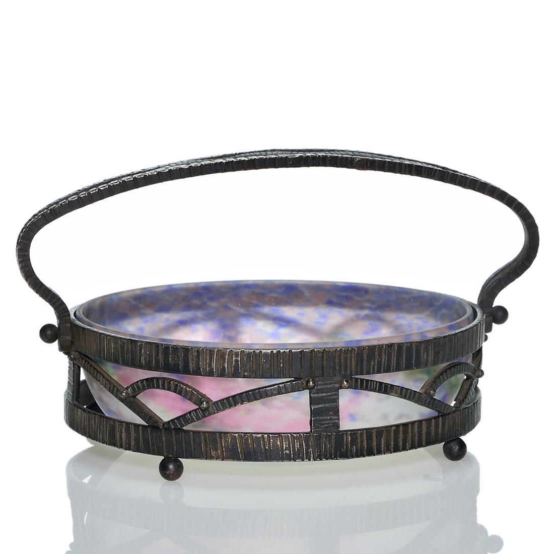 Art & Crafts Muller Fres bowl, Katona-style iron basket: Art & Crafts Muller Fres Luneville bowl fitted within a Louis Katona-style forged wrought iron basket. The acid finish bowl in pink, cobalt, green and cream bears the company name on the side and meas