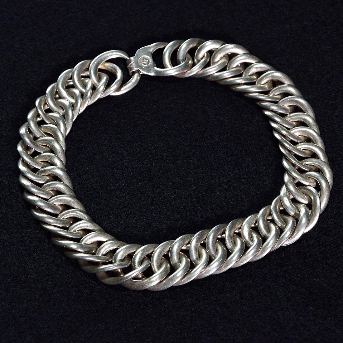 William Spratling 42 link sterling silver necklace,15: William Spratling sterling silver necklace consisting of 42 large uniformly woven links. Impressed with the WS, Spratling, Made in Mexico print circle logo, circa 1940s and having Sterling impressed o