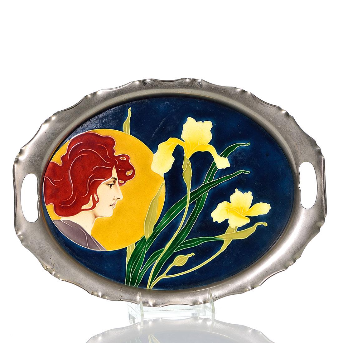 Von Schwarz tray, Karl Luber, Woman, irises 10 x 13 1/4: Johann Von Schwarz Norica tray, a ceramic tile housed in a metal surround with handle cutouts. The tile itself features a beautiful Art Nouveau woman with red hair in a golden circle looking at bright