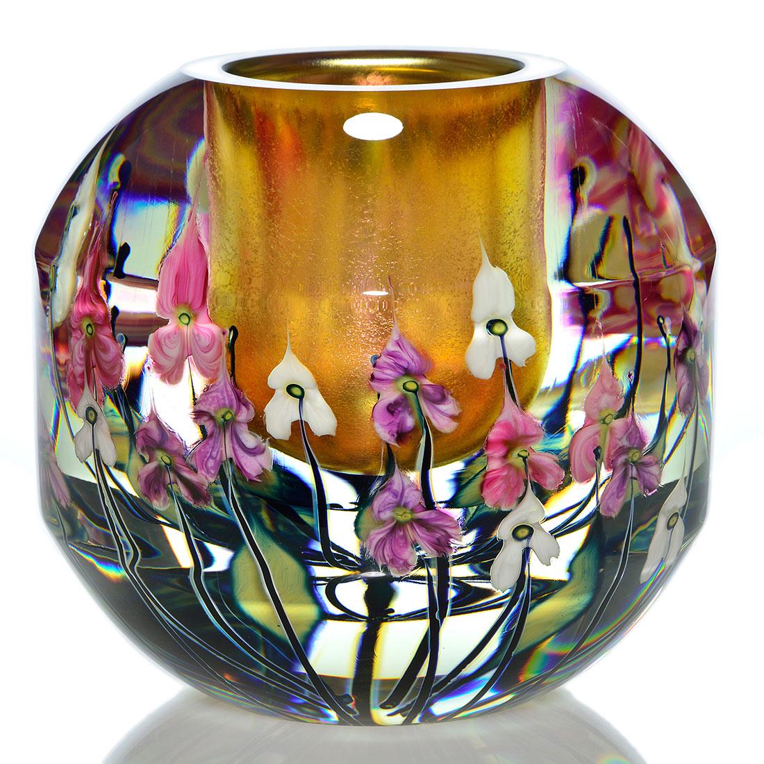 John Lotton Magnum vase, amber core, 8”, 2003: Good John Lotton Magnum Paperweight vase revealing three layers of pink, white and purple flowers above black silvery stems and their custard blue foliage standing guard before an attractive craquelle