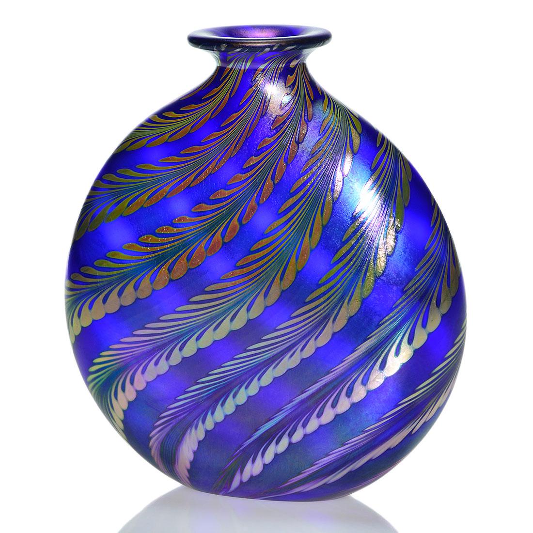 Correia Flask vase, cobalt, Fernery, 8”, ‘: Correia Art Glass cobalt blue flask vase having reverse swirl fern fronds in iridescent gold created in 1986. Measures 8 inches by 7 1/2 inches across. Engraved Correia VMSIC-1-864. Excellent conditio