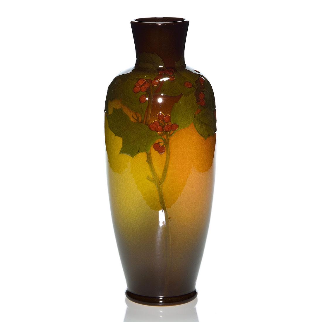 Rookwood Standard vase, Daly, 1902, 356 C, 13”,: Tall Standard glaze vase with holly decoration painted by Matt Daly in 1902. Marks include the Rookwood logo, date, shape 356 C, an incised Y for Yellow (Standard) glaze and Mr. Daly’s incised s