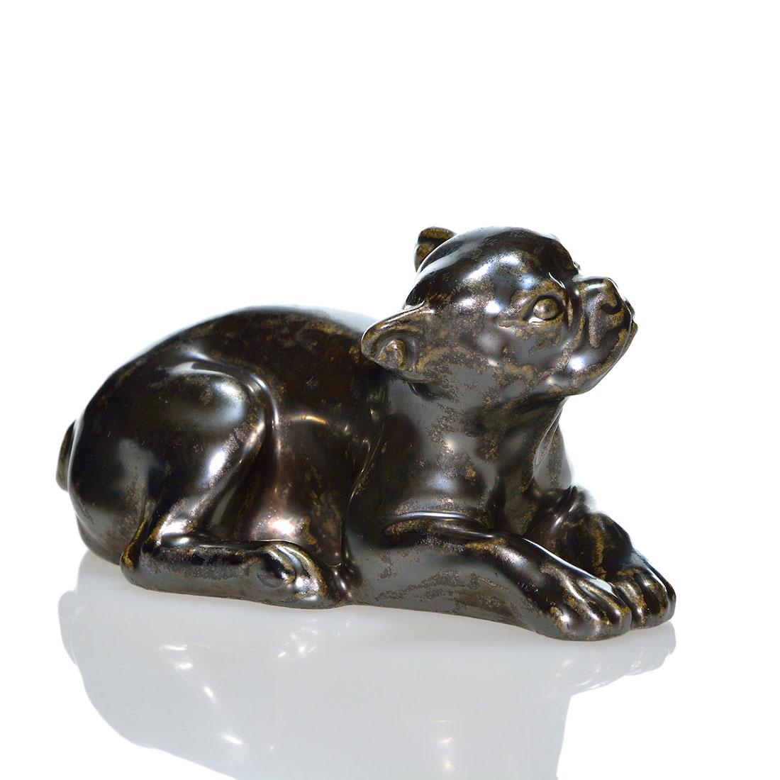 Rookwood Lying Down Butch pw, Nubian Blk, 6481,2: Lying Down Butch paperweight, a Louise Abel design based on a dog E.T. Hurley owned, cast in 1934 and covered in the Nubian Black glaze. Excellent original condition. Size is 2 1/2 inches high by 4 3/