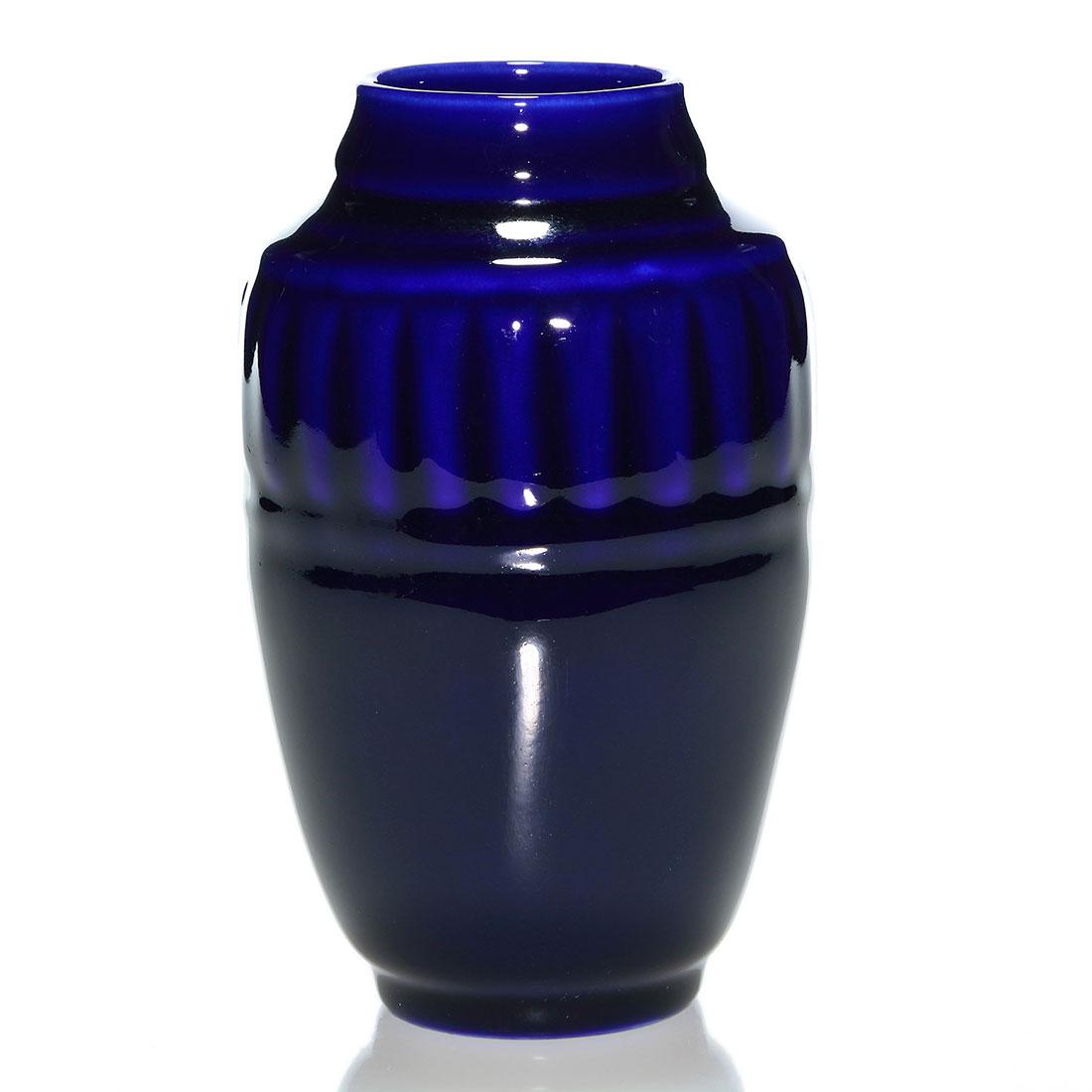 Rookwood Production vase, cobalt high glaze, 1936,: Production vase with molded ribbed design, cast in 1936 and covered with a deep cobalt high glaze. Marks include the Rookwood logo, date and shape 6465. Uncrazed but having a single, light glaze scrat