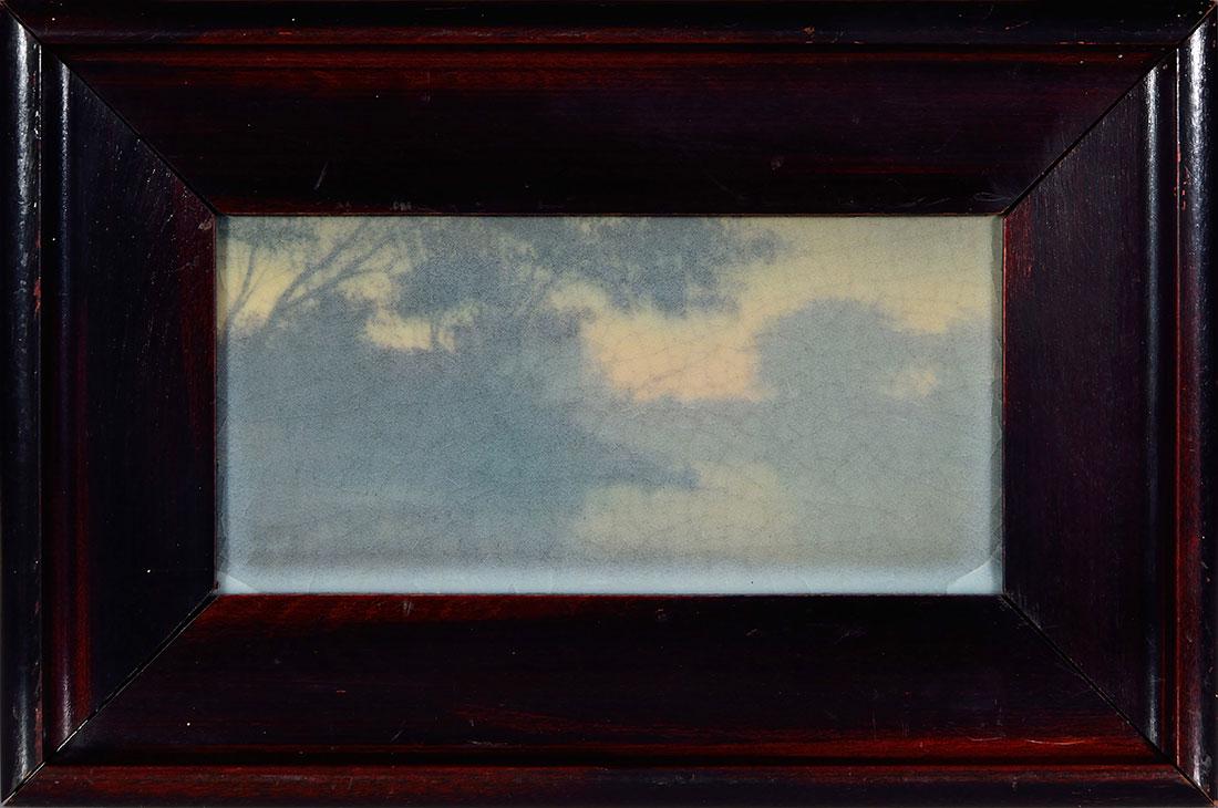 Rookwood Vellum plaque, 3.75” X 7.5”,: Scenic Vellum plaque decorated by E.T. Hurley in 1912 with the depiction of a stream going between tree-lined shores, done in a tonalist manner. Impressed on back with the Rookwood symbol, the date an