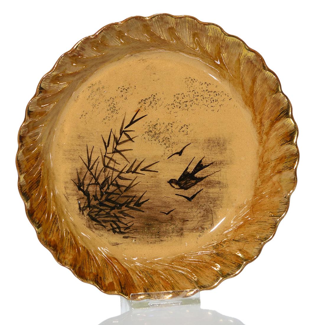 Rookwood Limoges 6 1/2” plate, 1883, NJH: Limoges style plate, 6 1/2 inches diameter, decorated with birds flying around bamboo shoots and enhanced with gold, by Nicholas Hirschfeld in 1883. Impressed ROOKWOOD, 1883, shape 140, G for ginger c