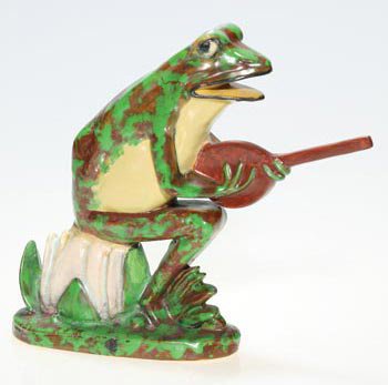Weller Coppertone "Banjo Frog", 7 1/2": Weller Coppertone "Small" Banjo Frog. Impressed with the Weller Pottery script mark. Restoration to the banjo and overspray to entire piece. Height is 7 1/2 inches. Cute and quite the musician.