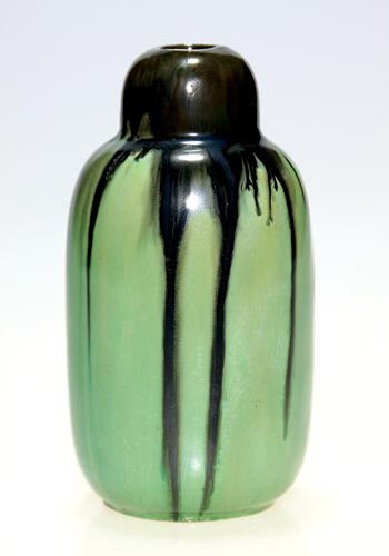 Fulper vase, black over Flemington Green, 5 1/2": Uncommon Fulper Pottery 5 1/2 inch vase covered in black over Flemington Green glaze which has a slight crystalline effect. Unmarked. There are a few tiny grinding nicks at the base.