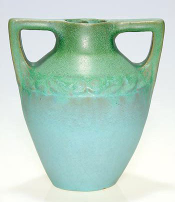 Van Briggle vase, green over blue, 7 1/4": Van Briggle 1907 to 1911 twin handled vase with green over blue mat glaze. Incised AA along with Van Briggle Colo. Spgs. 15 7." Height 7 1/4 inches. Some broad crazing in the lower portion and a few m