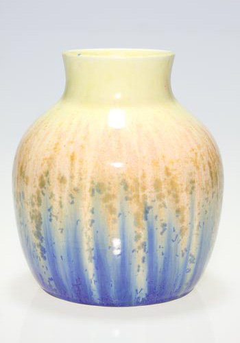 Ruskin 6 1/4 vase with drip crystalline glaze: Ruskin Pottery 6 1/4 inch vase cast in 1932 and covered with a crystalline drip glaze in colors of blue, green and pink on a yellow ground. Impressed Ruskin, 1932 and England on the base. No crazing.