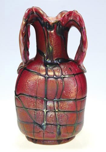 Pallme-Konig vase, palm leaf handles, red, 12 1/2": Monumental Pallme-Konig vase displaying large and floppy "palm leaf " handles sheared from the rim then tooled with "vein" impressions. The textured and dimpled red glass reflects a nice iridescence o