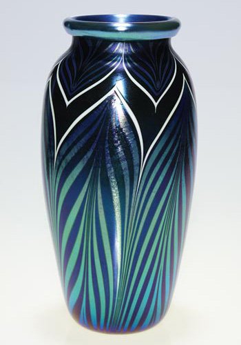 Orient & Flume pulled feather vase, 1983, 10 1/2": Orient & Flume vase displaying double pulled feather designs in silvery blue over a cobalt backdrop. The feathers are outlined in bright white, the rim tightly cuffed. Height 10 1/2 inches. The factor