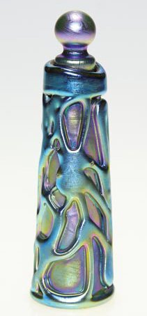 Mark Peiser perfume, stopper, blue, vines, 5": Unusual perfume with ball stopper created by Mark Peiser in 1973. The slender form has thickly applied vines, the bottle covered in iridescent blue. Beautiful rainbow highlights are in the recesses. H