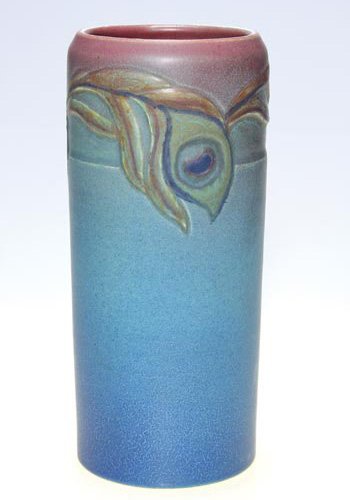 Rookwood carved mat, peacock, Todd, 10 3/4": Carved and painted mat glazed cylindrical 10 3/4 inch vase, decorated by Charles Todd in 1913 by deeply incising and then coloring peacock feathers around the vessel. Impressed with the Rookwood logo,