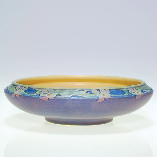 Newcomb carved low bowl, mat floral, Irvine, 1917, 2" X: Newcomb College Pottery low bowl encircled with a border of white narcissus, carved and painted by Sadie Irvine in 1917. Impressed with the Newcomb logo, shape 277, the JB 36 date code and Joseph Meye
