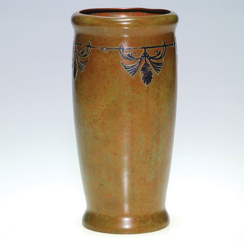 Silvercrest silver over bronze vase, pine cones, 8 3/8": Silvercrest bronze vase with sterling silver overlay. Marked on bottom with the Silvercrest logo and item number B 1020. Pleasant patina with a minor dent at the rim. Height 8 3/8 inches.