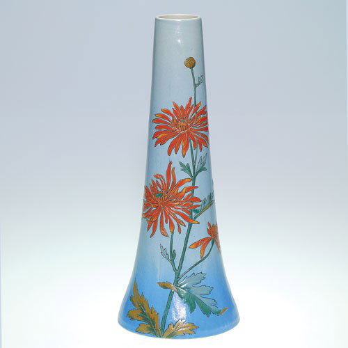 Mettlach 13 1/2" vase, incised and painted flowers: Mettlach 13 1/2 inch vase with orange flowers and green and brown leaves. Impressed with the Mettlach logo, the name "Geshgesch," number 2679 and number 03. Without crazing and in excellent original c