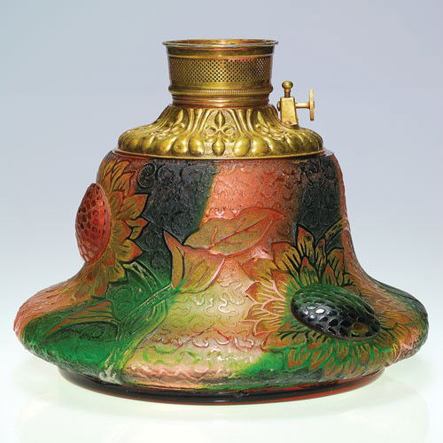 Daum cameo oil lamp, sunflower with raised centers, 8 1: Daum Nancy cameo lamp base. The bell form body displays a trio of sunflowers each having applied cabochon centers. The flowerheads on graceful stems are set against a "squiggly" cameo backdrop, gold e