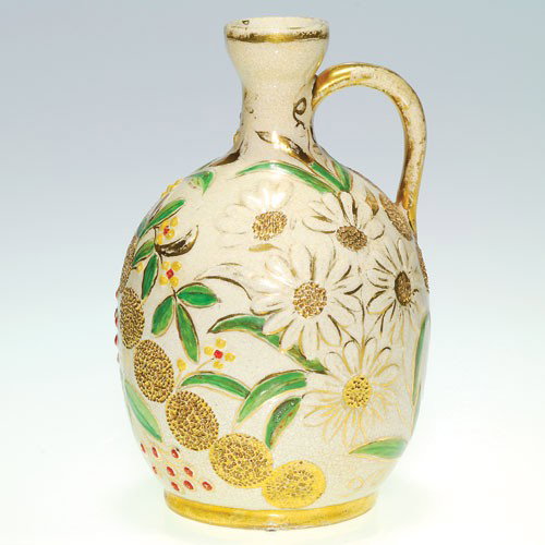 Cincinnati Art Pottery 6" jug, Hungarian Faience floral: Cincinnati Art Pottery 6 inch jug with floral designs in the Hungarian Faience style. Marked on the bottom with the initials C.E.N. in gold. There is fine overall crazing, a mild firing separation on