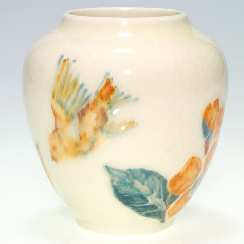 Rookwood Junior Decorator vase, 1945, 6459, bird, 4 1/2: Vase with molded decoration of a bird flying around flowers and plants, hand colored by a member of the Junior Decorating staff in 1945. Impressed with the Rookwood logo, the date and shape 6459. Ther