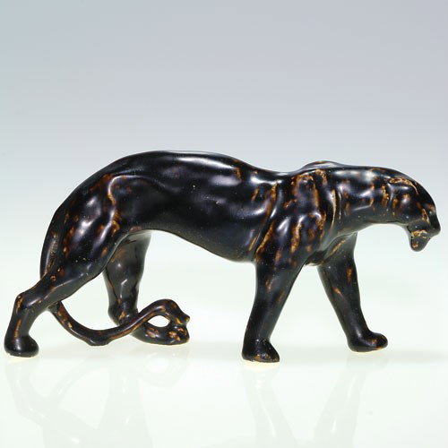 Rookwood panther paperweight, Nubian Black, 1924: Panther paperweight, designed by William McDonald, cast in 1924 and covered with the Nubian Black glaze. Lightly impressed with the Rookwood logo, the date and shape 2563. No crazing with professional
