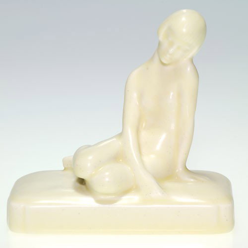 Rookwood 4" Nude paperweight, 1930, Ivory, Abel design: Deco styled paperweight depicting a nude young woman lounging on a pillow, a Louise Abel design, cast in 1930 and covered with the Ivory Mat glaze. Impressed with the Rookwood logo, the date, the desi