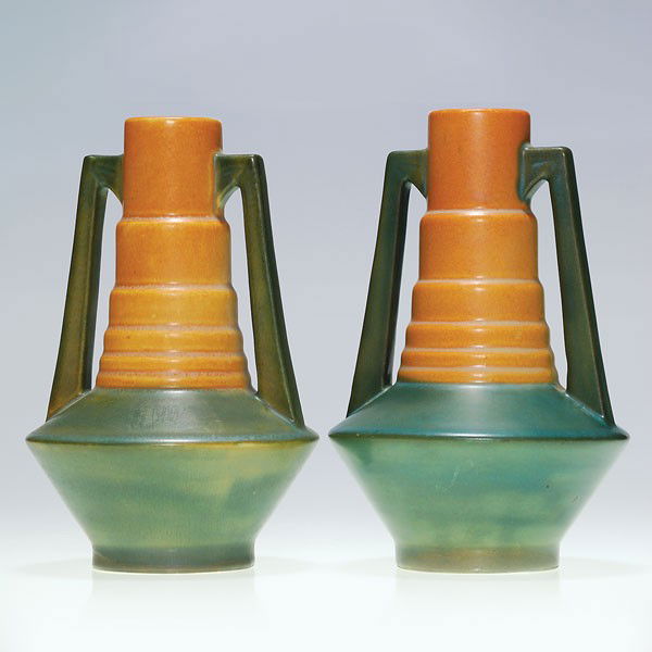 2 Roseville Futura "Telescope" vases, shape 382-7": Pair of 7 1/4 inch Roseville Futura "Telescope" vases, shape 382-7". One still bears an original partial Roseville sticker. The one with the label has a tiny nick at the shoulder, the other has a bit