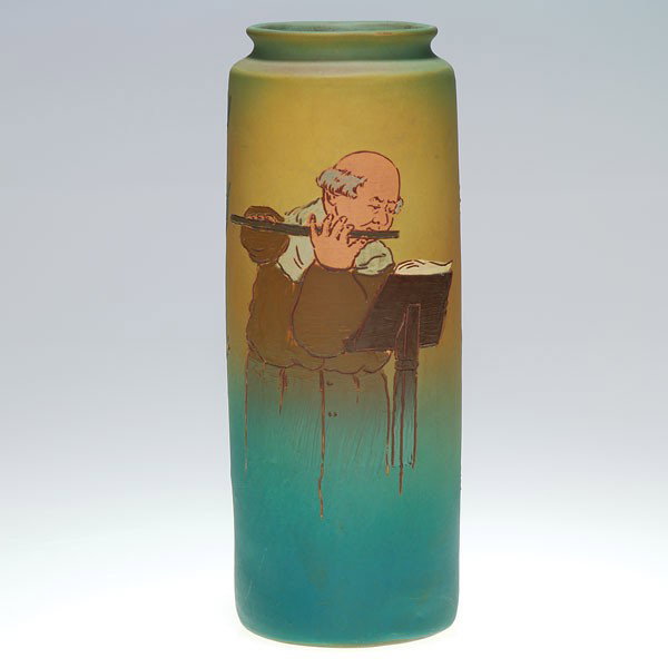 Weller Dickens Ware II 10 1/4" vase, monk.: Weller Second Line Dickens Ware 10 1/4 inch vase depicting a balding monk playing his flute while reading the music from a tome on a music stand. Impressed with the Dickens Ware Weller logo and 602 1.