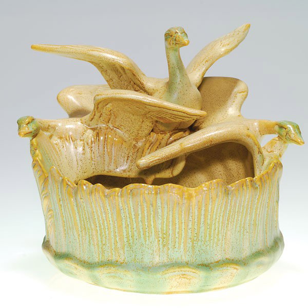 Weller Patricia 7 1/2" bowl, 3 swans, green-brown : Weller Patricia 7 1/2 inch bowl with three swans, wings spread, landing on the rim of the vessel, which is covered with a good green and brown crystalline glaze. Marked with the "incised" Weller Potte