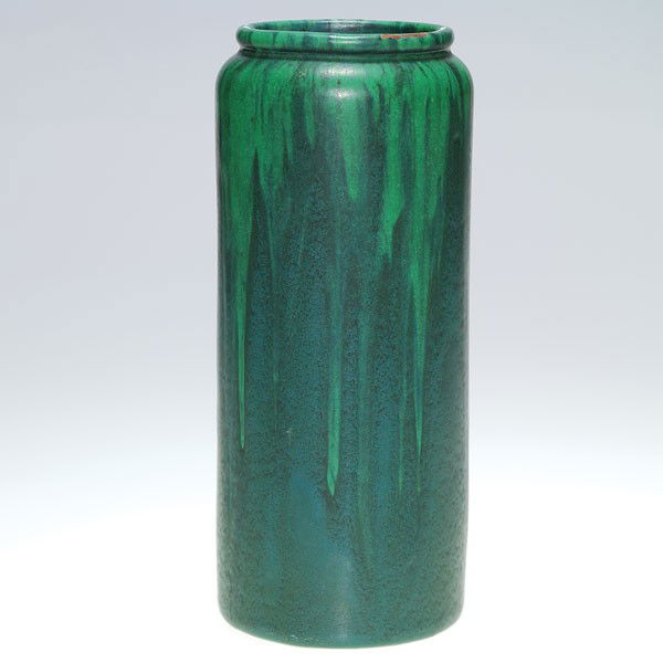 Peters and Reed Shadoware vase in green over green: Peters and Reed Shadoware vase with a most pleasant lighter green over dark green ground. Impressed Zane Ware logo partially obscured by glaze. Height 8 7/8 inches. There is a 1/8 by 1 inch area of gl