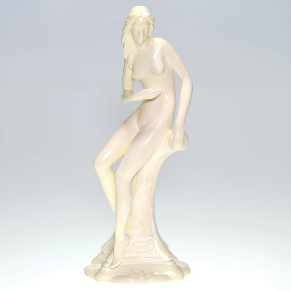 Cowan Woodland Nymph statuary, Gregory design, D-1: Graceful Cowan "Woodland Nymph" statuary by Waylande Gregory with his name molded into the stump. The 14 inch figure is covered in a nice ivory glaze showing a slight tinge of pink. Block letters and 
