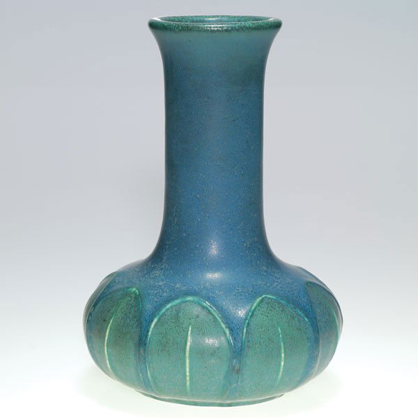 Hampshire blue mat, shape 124, leaves, 9 1/2": Hampshire Pottery vase encircled with a leaf design and covered with a good mottled blue glaze. Impressed with the Hampshire logo, shape 124 and the "Emoretta" mark. No crazing and in excellent origin