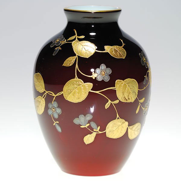 Thomas Webb cased vase, gold & silver decorated, 5: Cased Thomas Webb & Sons ox blood vase ornamented with gold and silver flowers and vines. Nice opal white interior. Height 5 inches. Attractive and in excellent condition.