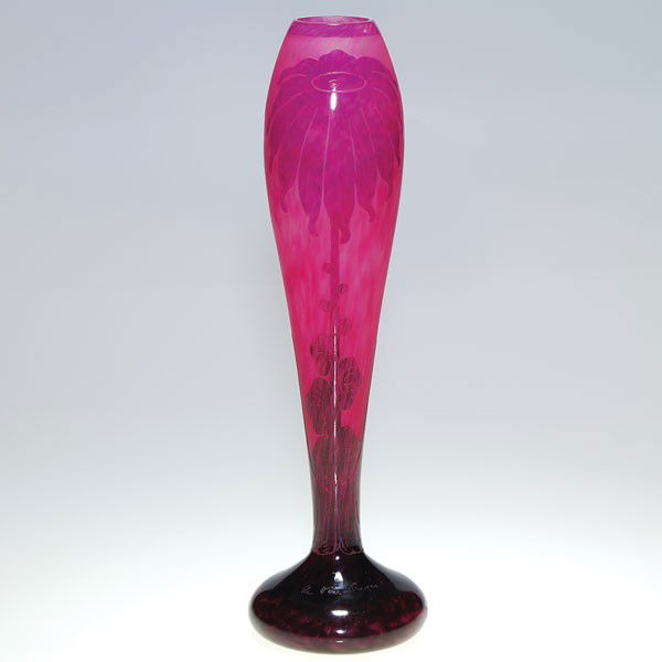 LeVerre Francais cameo vase, sunflower, 17", signe: Slender Le Verre Francais floriform vase, displaying in cameo, a sole sunflower above a stout foliate stem on two sides. The 17 inch vase created in raspberry, mulberry and deep wine and has the name
