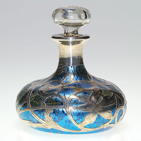 Loetz blue oil spot perfume, silver overlay, 4 1/8: Loetz blue "Papillon" perfume lavished with sterling silver overlay. The silver has cone flowers and scrolling vines over a nice blue surface. The clear teardrop stopper has a silver overlay flower. H