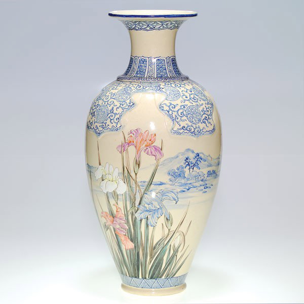 Oriental semi-porcelain vase, scenic, floral, 20": Oriental semi-porcelain vase, the shoulder draped and decorated with blue and white scrolls and medallions. The body displays a stand of irises on either side, the white irises enameled and the remain