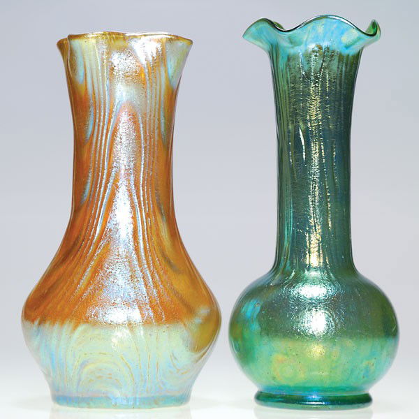 2 Loetz vases: gold "Oceanik" & green "Rusticana",: Two Loetz vases. 1) An 8 1/4 inch iridescent gold with the intriguing "Oceanik" pattern and crowned with a folded rim. 2)An 8 3/4 inch "Rusticana" in iridescent green topped with a ruffled rim and was