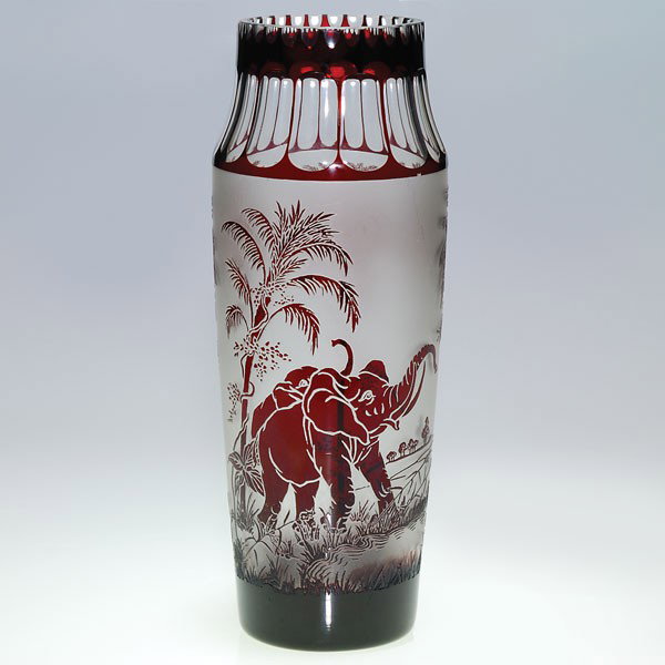 Bohemian Moser-style Elephant vase, 12": Bohemian Moser-style cameo vase with two elephants ambling beneath a grove of palm trees, the shoulder polished with optical cuttings. Height 12 inches. Later acid stamped Moser Karlsbad on the bottom