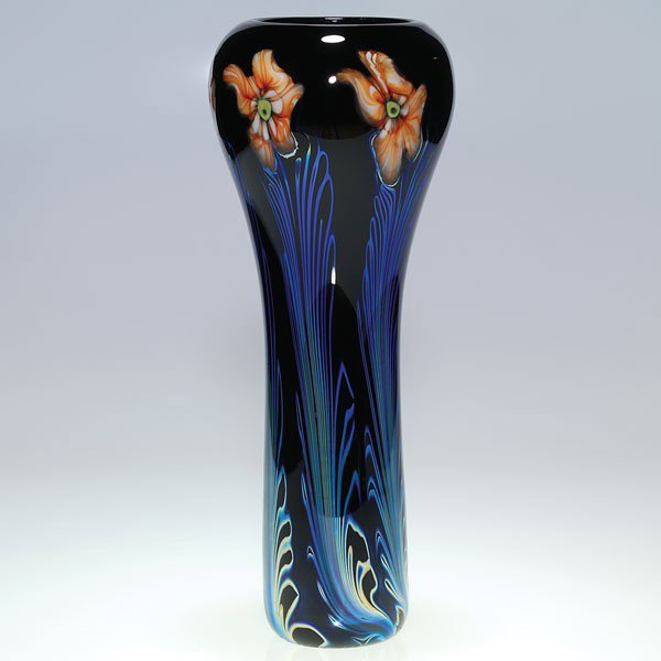 Charles Lotton black Multi Flora vase, orange flow: Beautiful Charles Lotton Multi Flora vase with six tall orange flowers arrayed around the vase with long, iridized leaves on a black ground. Signed and dated by the artist. Height 13 1/8 inches. Excel