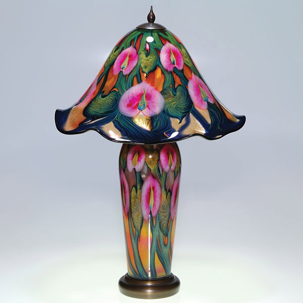 Daniel Lotton Multi Flora glass in red, 26 1/2": Handsome Daniel Lotton table lamp produced in the year 2000. The shade and base share a delightful arrangement of life sized Calla lilies in pink surrounded by thick stems with foliage in cobalt blue
