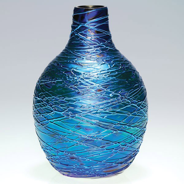 Orient & Flume vase, blue threaded, '77: Orient & Flume gourd vase in iridescent blue caressed with same color threading. Imitating the old masters glassware, this vessel stands 6 1/4 inches. Signed "Orient & Flume" with the date 1977 beside
