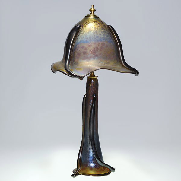 Herb Thomas two part lamp, oil spot glass, organic: Art Nouveau style table lamp made by Pennsylvania glass artist, Herb Thomas. The "oil spot" treatment of the glass and the thick, dark, tendrils on the shade and base give the lamp a very organic look